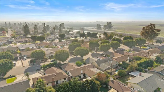 an aerial view of residential building with green space