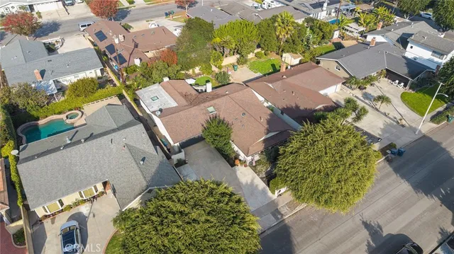 an aerial view of residential building with green space