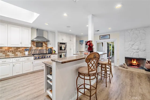 a kitchen with a table and chairs in it