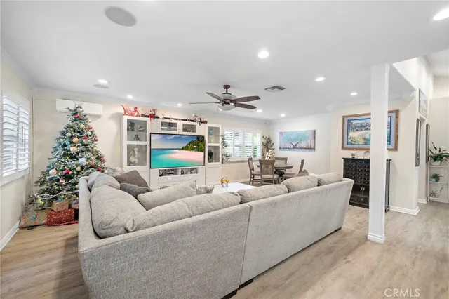a kitchen with a refrigerator and a stove top oven