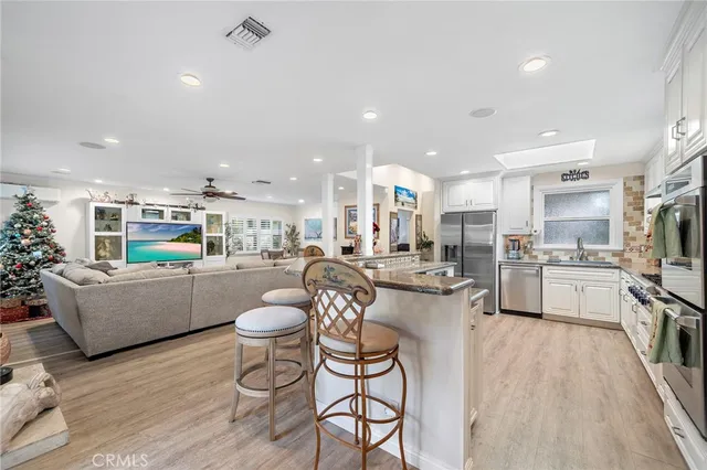 a kitchen with stove and cabinets