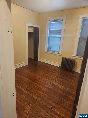 a view of front door with wooden floor