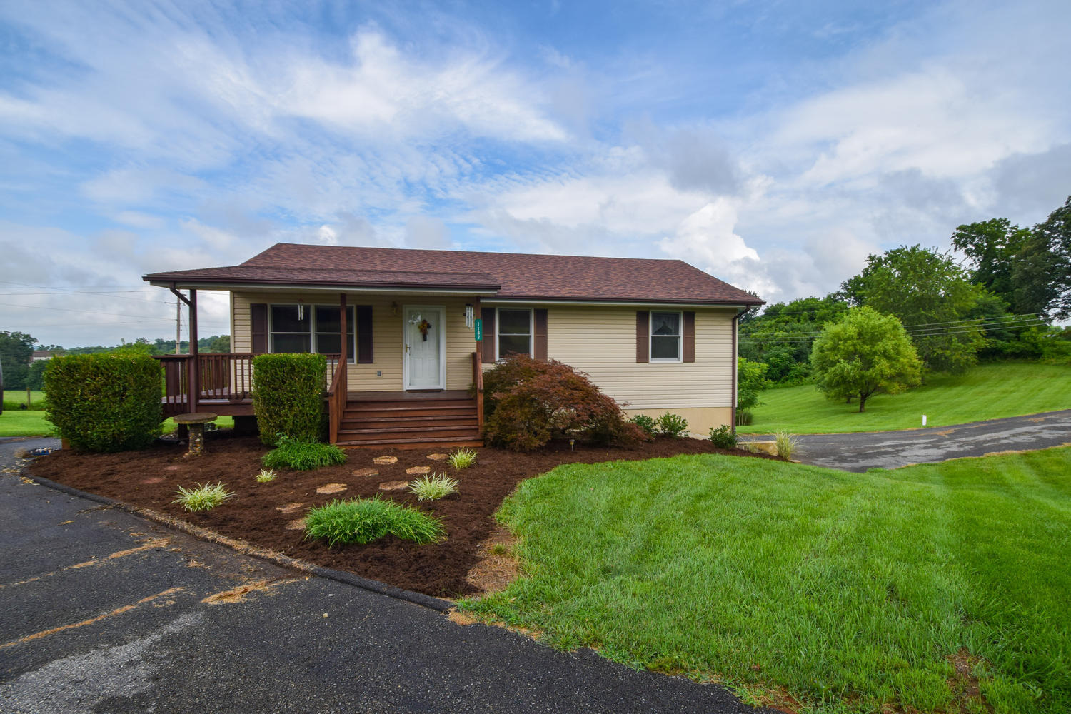 1167 Mill Iron Road Goodview, VA 24095 - Photo 2 of 19 a view of a house with backyard and garden