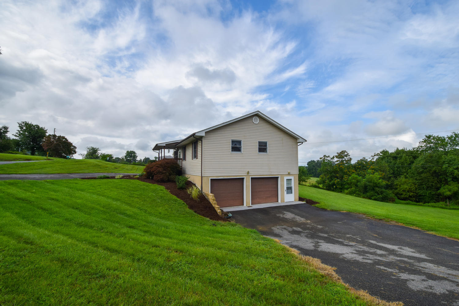 1167 Mill Iron Road Goodview, VA 24095 - Photo 11 of 19 a view of a house with backyard and garden