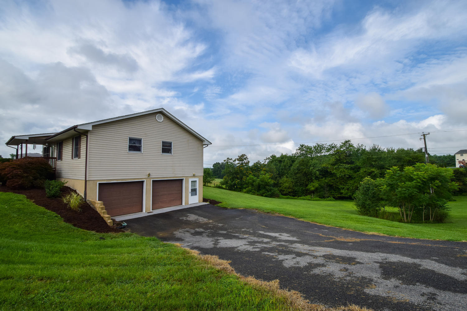 1167 Mill Iron Road Goodview, VA 24095 - Photo 12 of 19 a view of a backyard with wooden fence