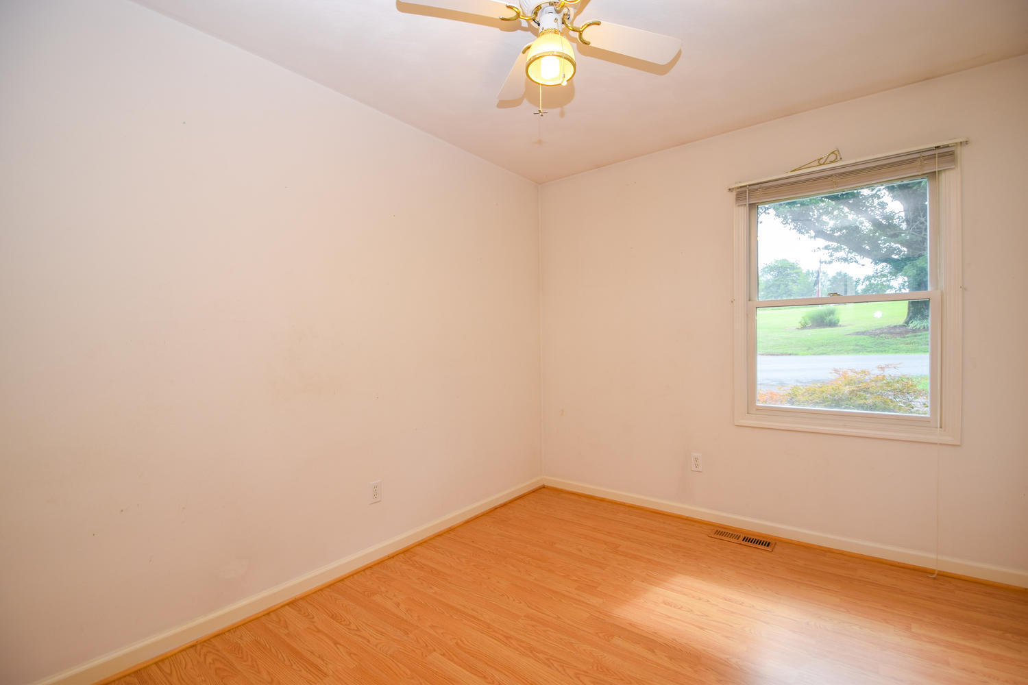 1167 Mill Iron Road Goodview, VA 24095 - Photo 6 of 19 an empty room with a window