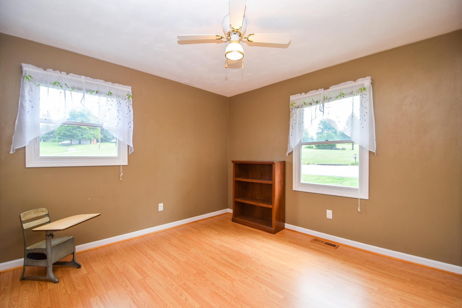 1167 Mill Iron Road Goodview, VA 24095 - Photo 8 of 19 a view of a room with window and ceiling fan