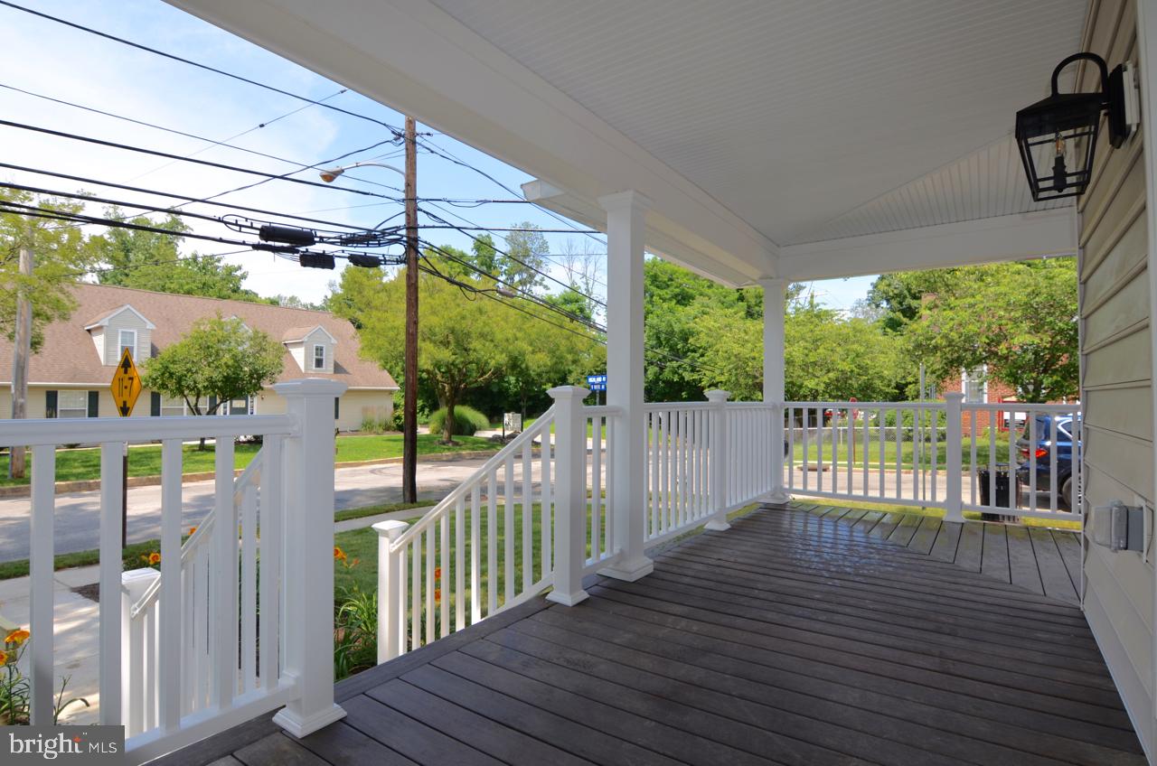 400 West Wayne Avenue, Unit 3 Wayne, PA 19087 - Photo 3 of 14 a view of a balcony with wooden floor