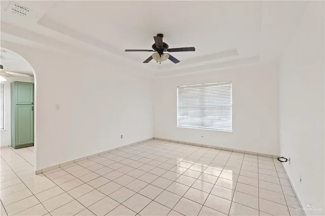 a view of an empty room and window