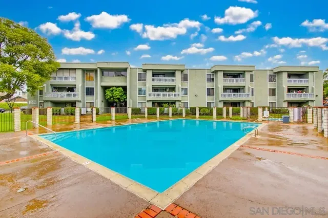a view of swimming pool with outdoor seating