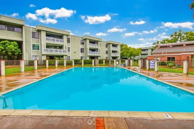 a view of an swimming pool with a yard