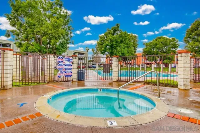 swimming pool view with a garden space