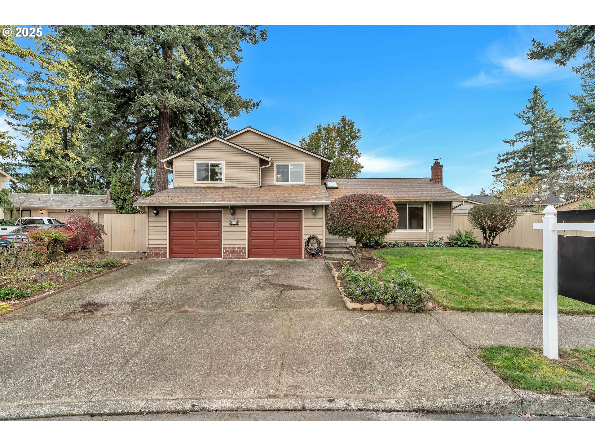 814 Northeast 196th Avenue Portland, OR 97230 - Photo 1 of 44 a front view of a house with a yard and garage