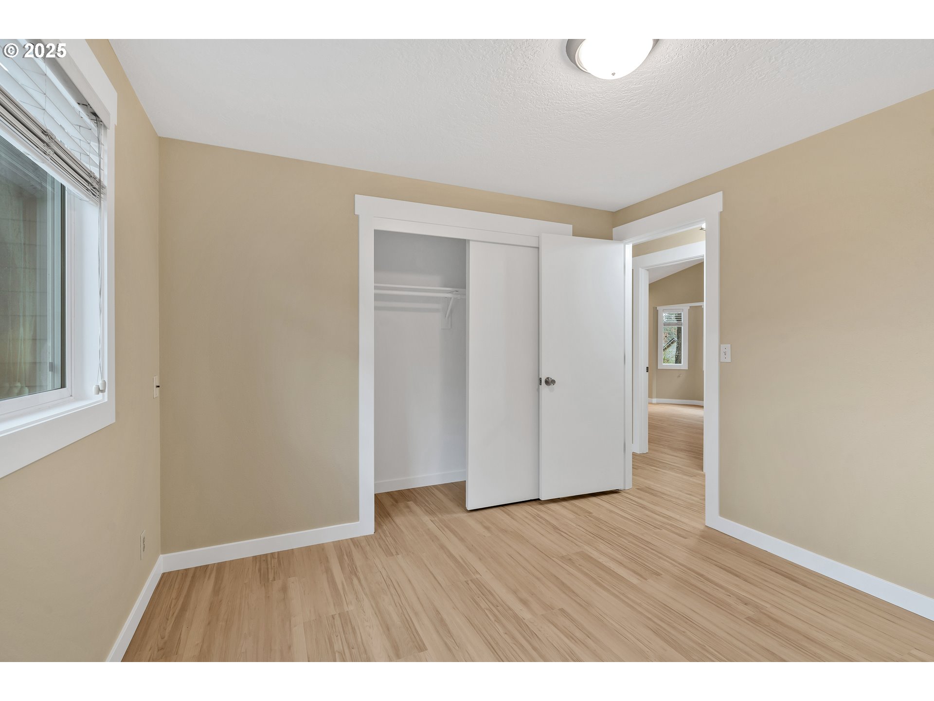 814 Northeast 196th Avenue Portland, OR 97230 - Photo 15 of 44 a view of an empty room with wooden floor