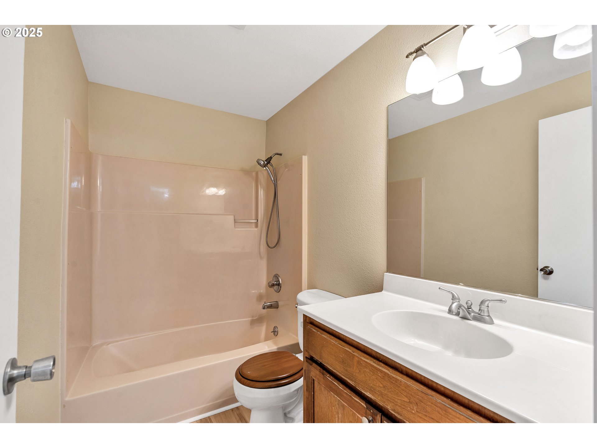 814 Northeast 196th Avenue Portland, OR 97230 - Photo 16 of 44 a bathroom with a bathtub shower sink vanity and toilet