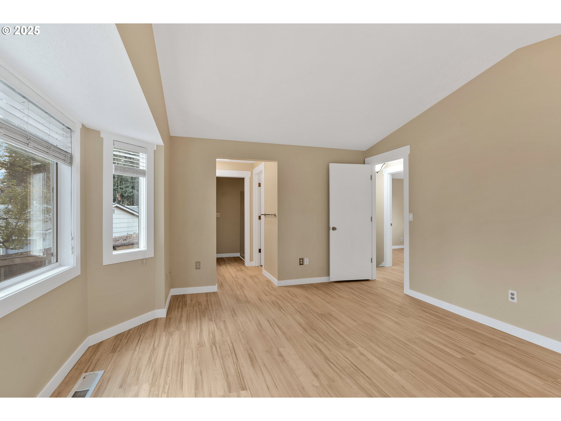 814 Northeast 196th Avenue Portland, OR 97230 - Photo 21 of 44 a view of an empty room with wooden floor and a window