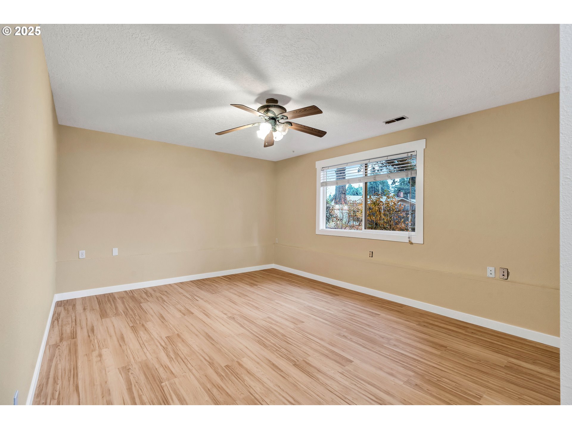 814 Northeast 196th Avenue Portland, OR 97230 - Photo 27 of 44 wooden floor in an empty room with a window