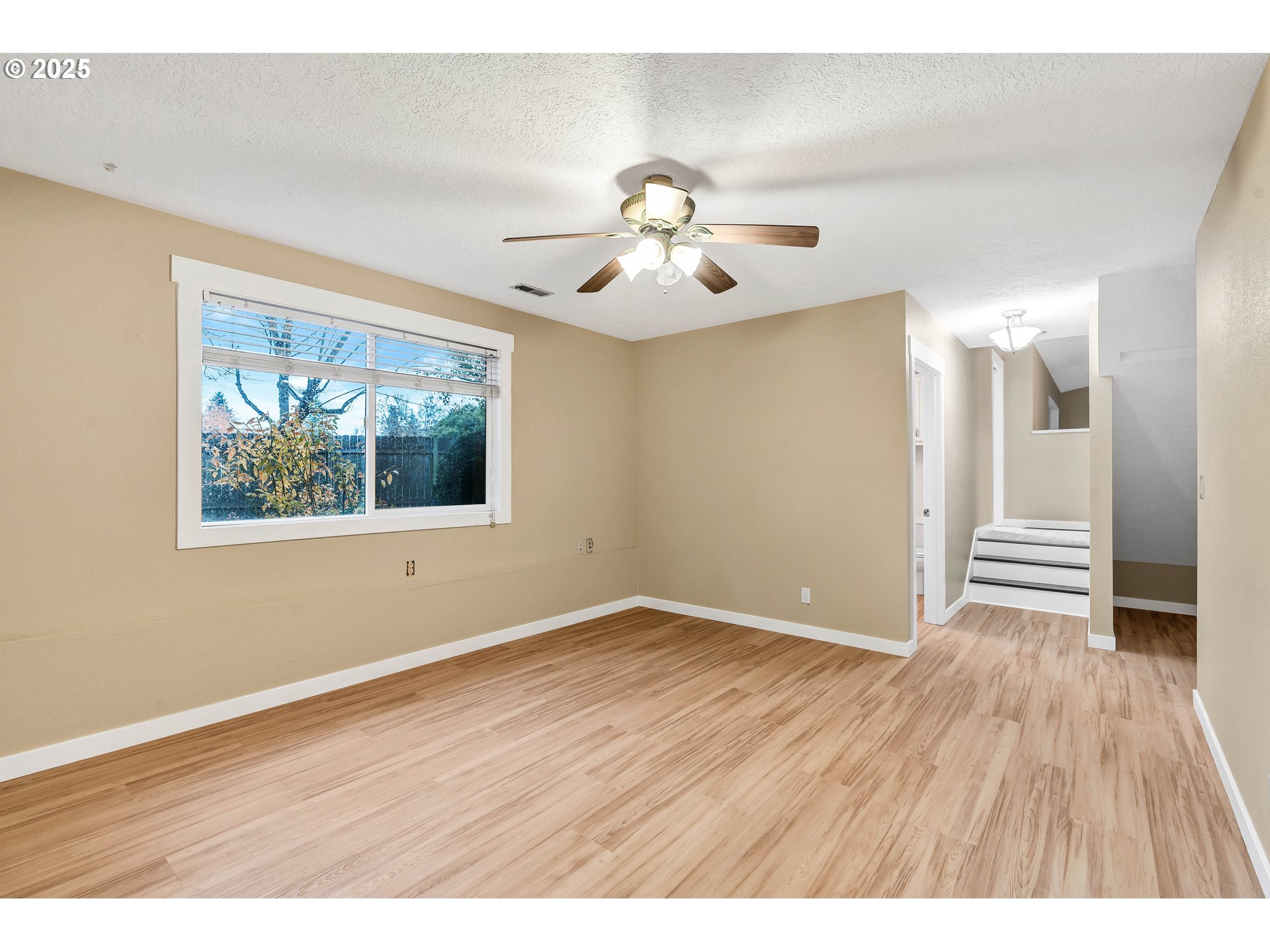 814 Northeast 196th Avenue Portland, OR 97230 - Photo 28 of 44 a view of an empty room with wooden floor and a window