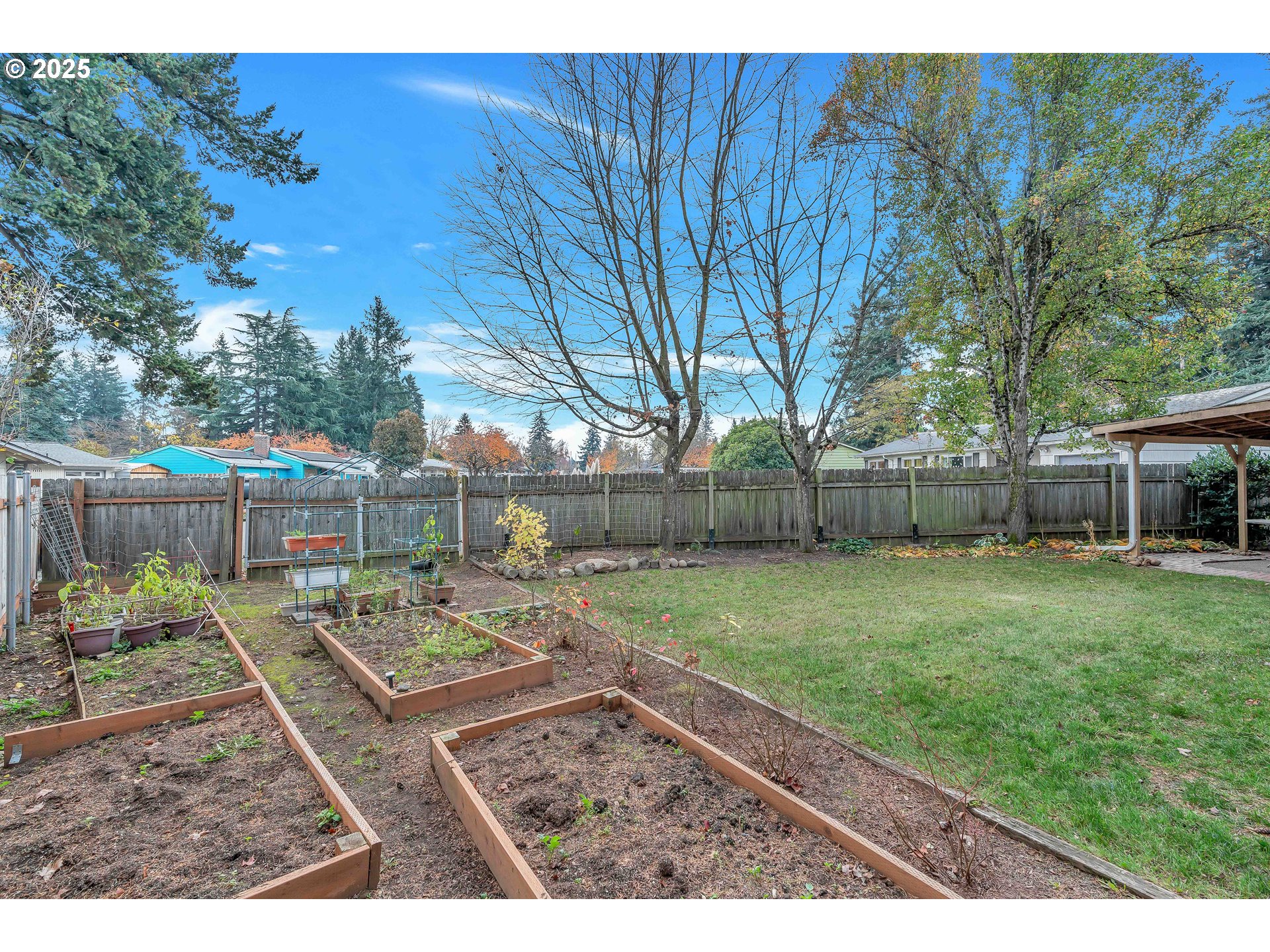 814 Northeast 196th Avenue Portland, OR 97230 - Photo 35 of 44 a view of a backyard with a garden and trees