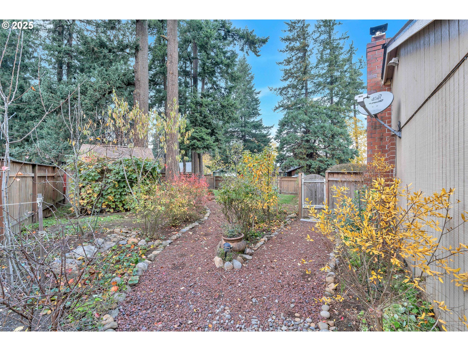 814 Northeast 196th Avenue Portland, OR 97230 - Photo 37 of 44 a view of a backyard with plants and large trees