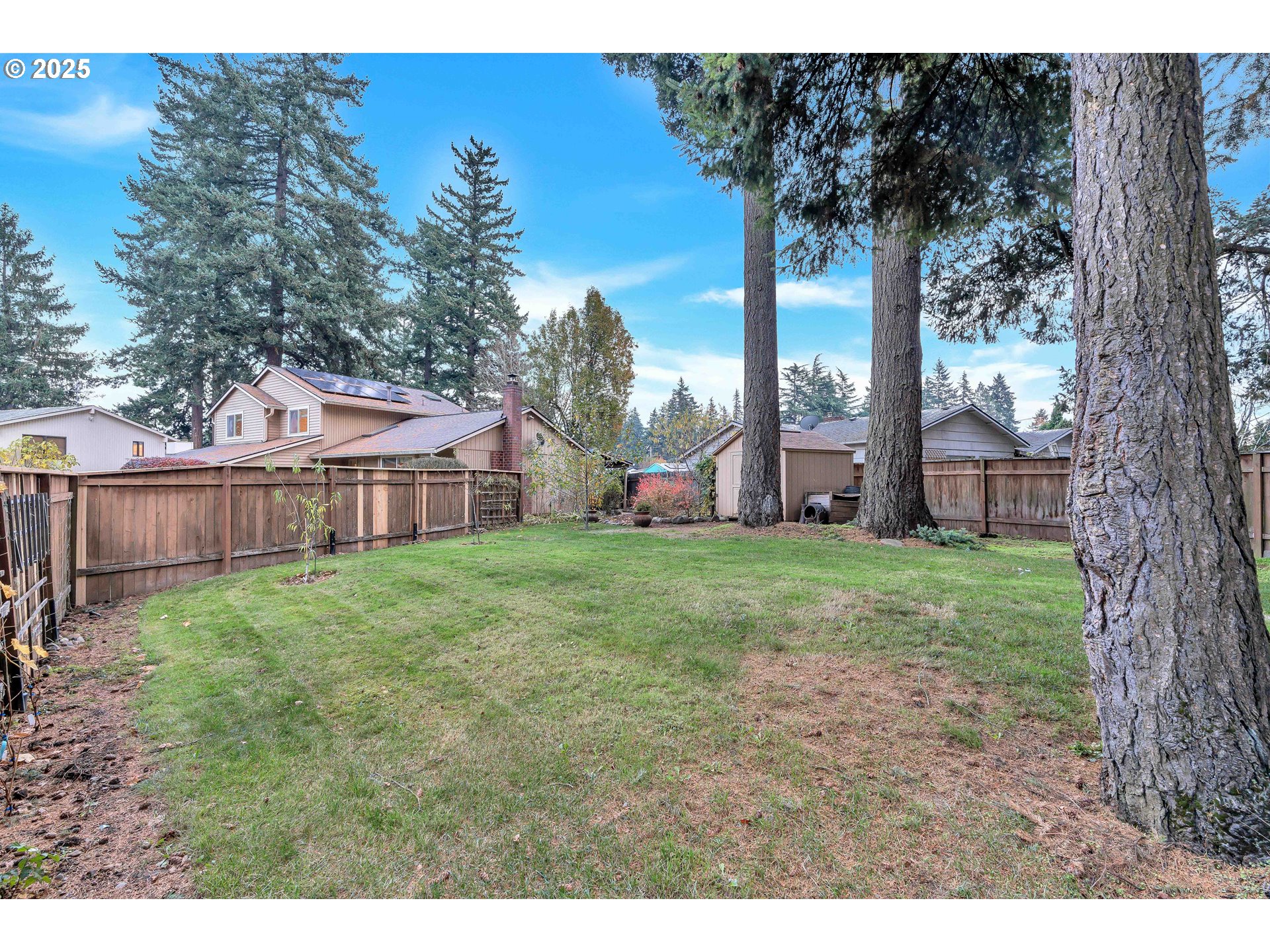 814 Northeast 196th Avenue Portland, OR 97230 - Photo 41 of 44 a view of a house with backyard and trees