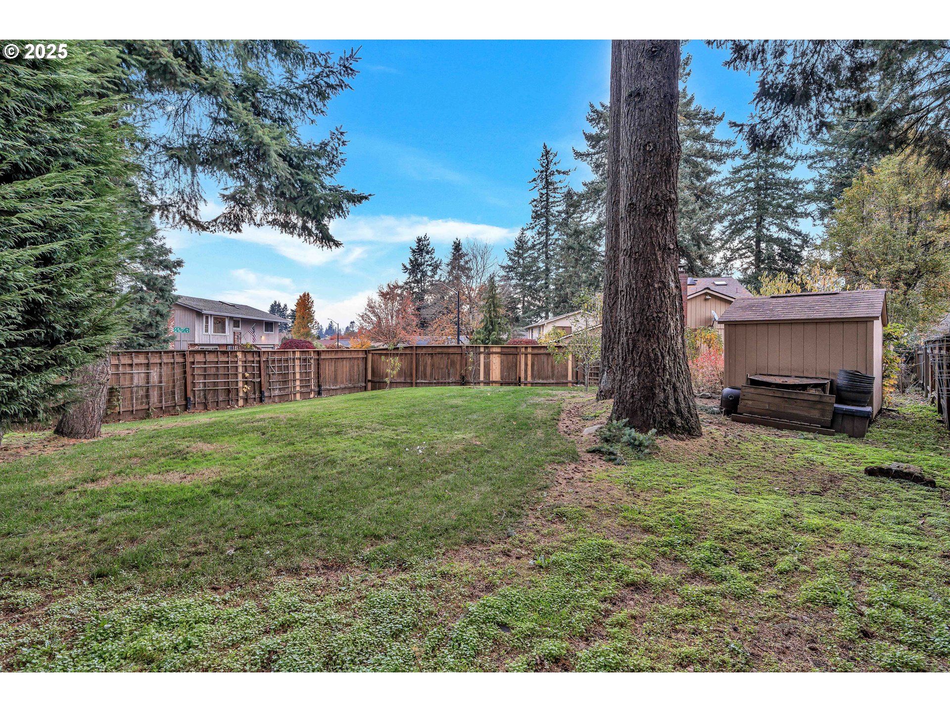 814 Northeast 196th Avenue Portland, OR 97230 - Photo 42 of 44 a view of a yard with a house in the background