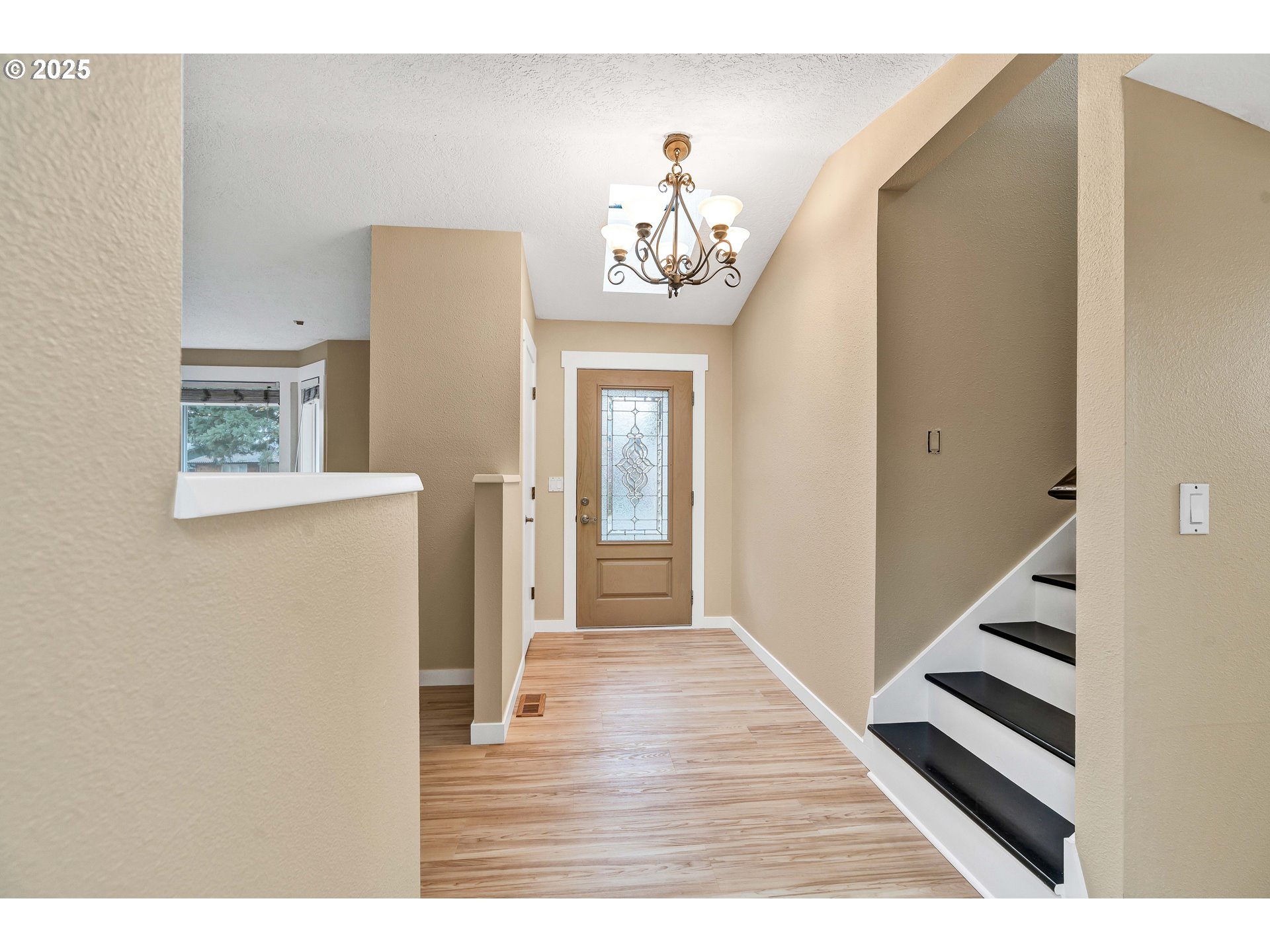 814 Northeast 196th Avenue Portland, OR 97230 - Photo 5 of 44 a view of a hallway with wooden floor and staircase