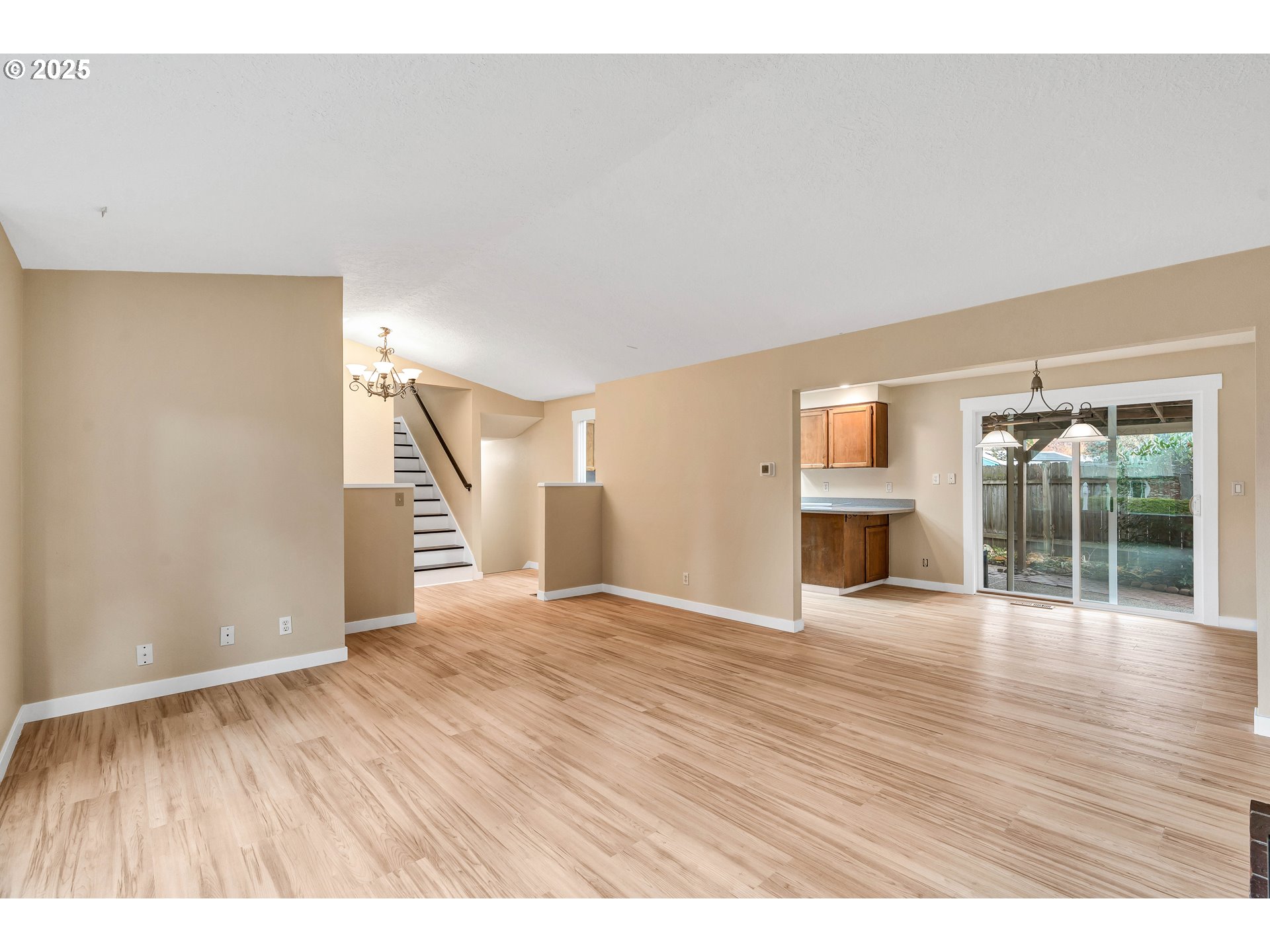 814 Northeast 196th Avenue Portland, OR 97230 - Photo 8 of 44 a view of an empty room with wooden floor and a window
