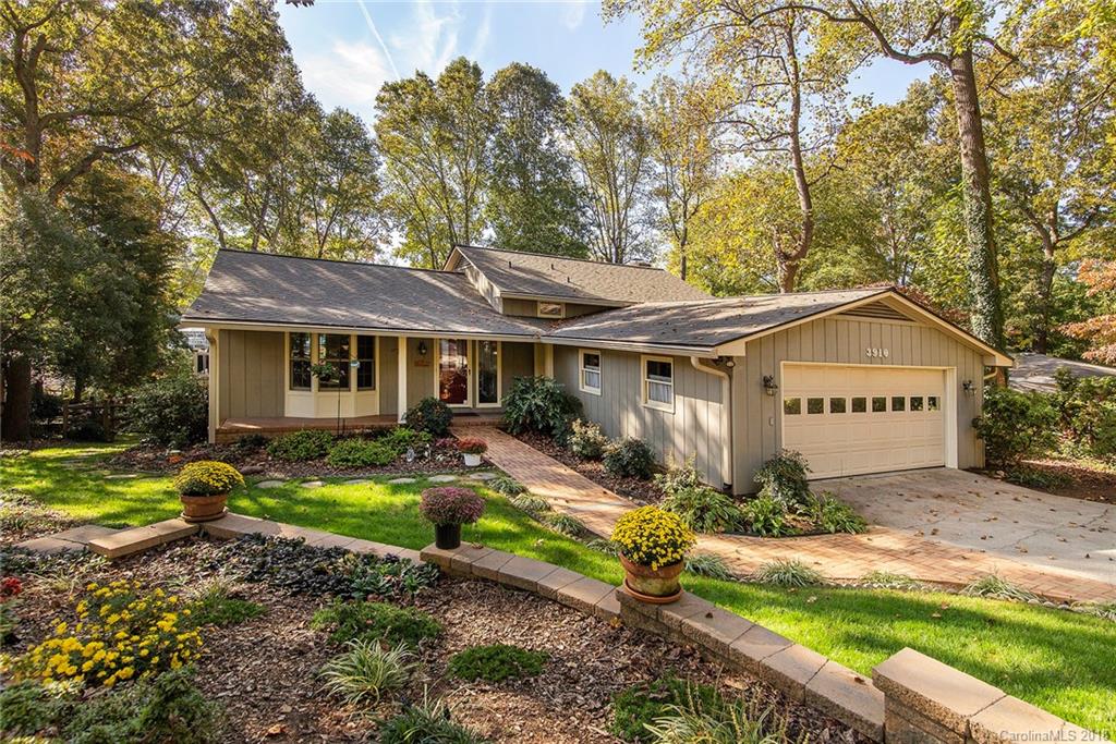 3910 Lake Shore Road South Denver, NC 28037 - Photo 1 of 25 a front view of a house with garden