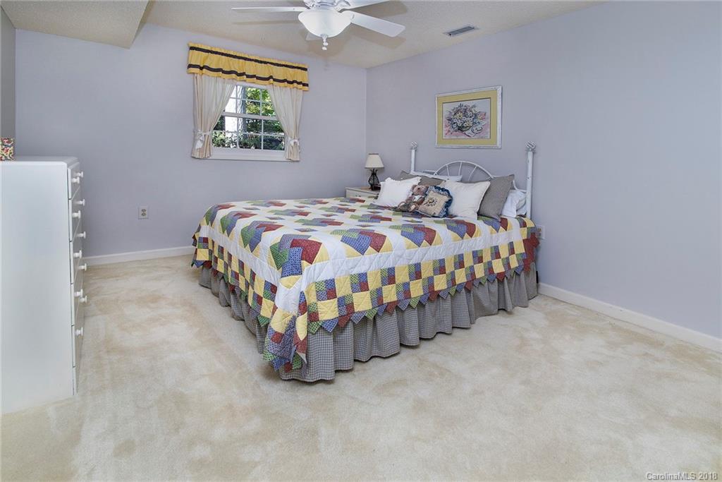 3910 Lake Shore Road South Denver, NC 28037 - Photo 17 of 25 a bedroom with a bed and a table