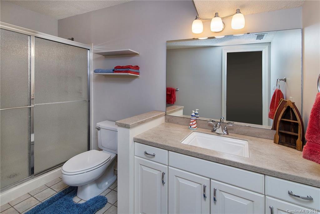 3910 Lake Shore Road South Denver, NC 28037 - Photo 18 of 25 a bathroom with a sink a toilet and shower