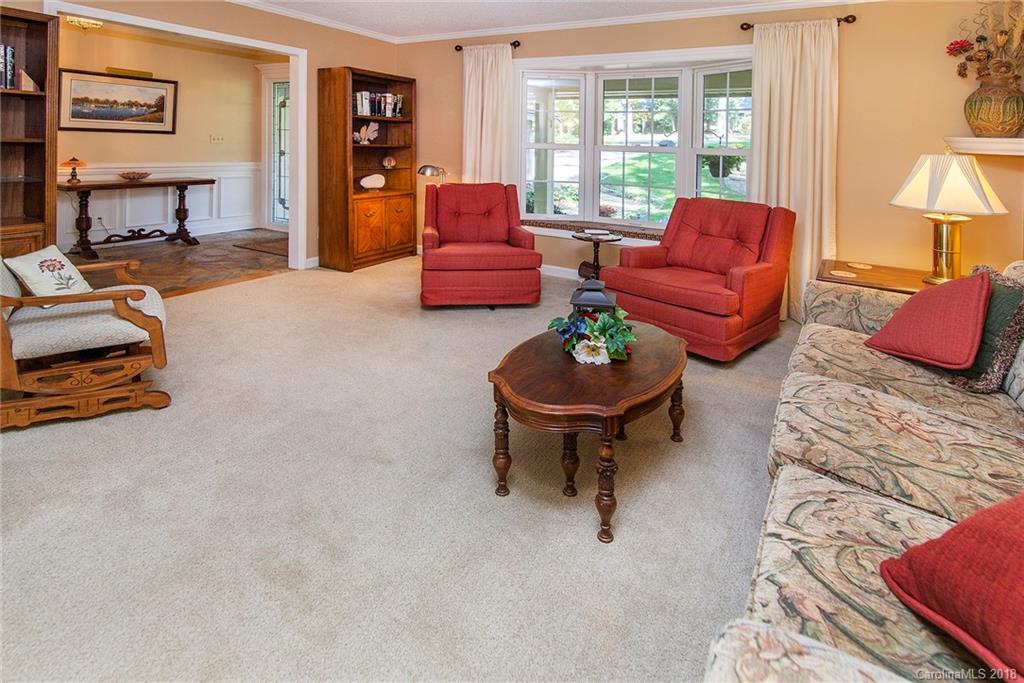 3910 Lake Shore Road South Denver, NC 28037 - Photo 4 of 25 a living room with furniture a fireplace and a large window