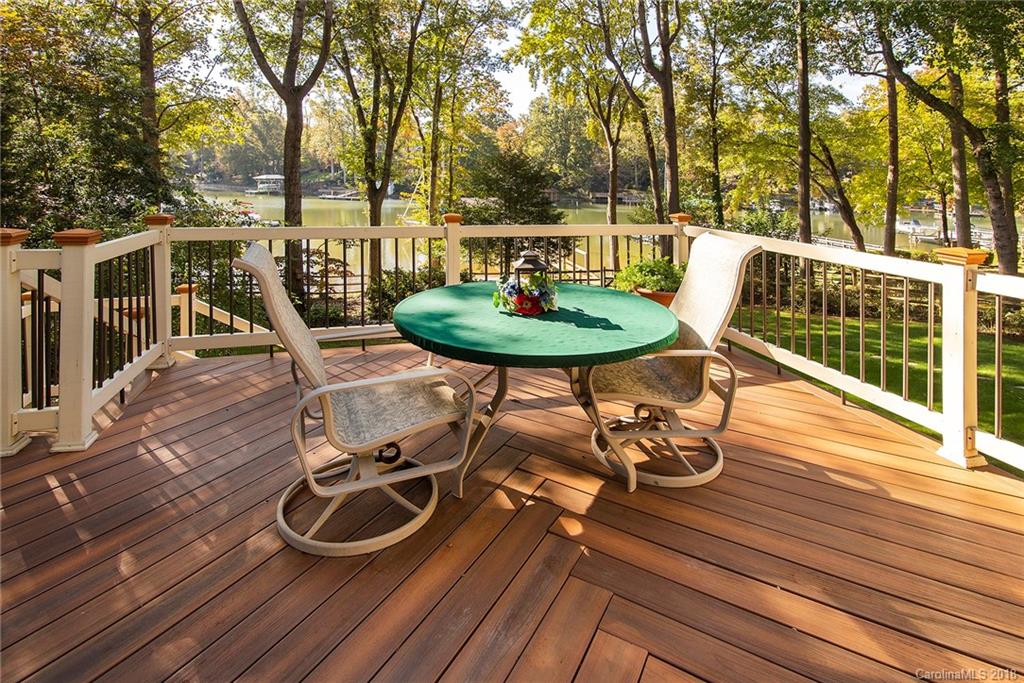 3910 Lake Shore Road South Denver, NC 28037 - Photo 6 of 25 a view of a chairs and table on the wooden roof deck