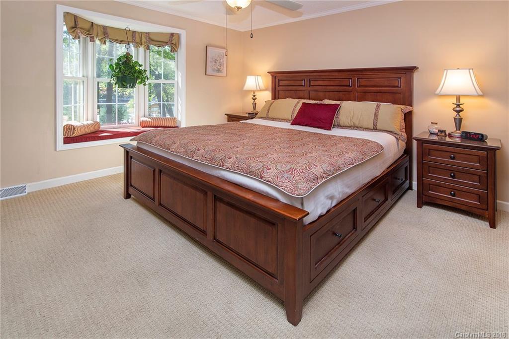 3910 Lake Shore Road South Denver, NC 28037 - Photo 10 of 25 a bed sitting in a bedroom next to a window