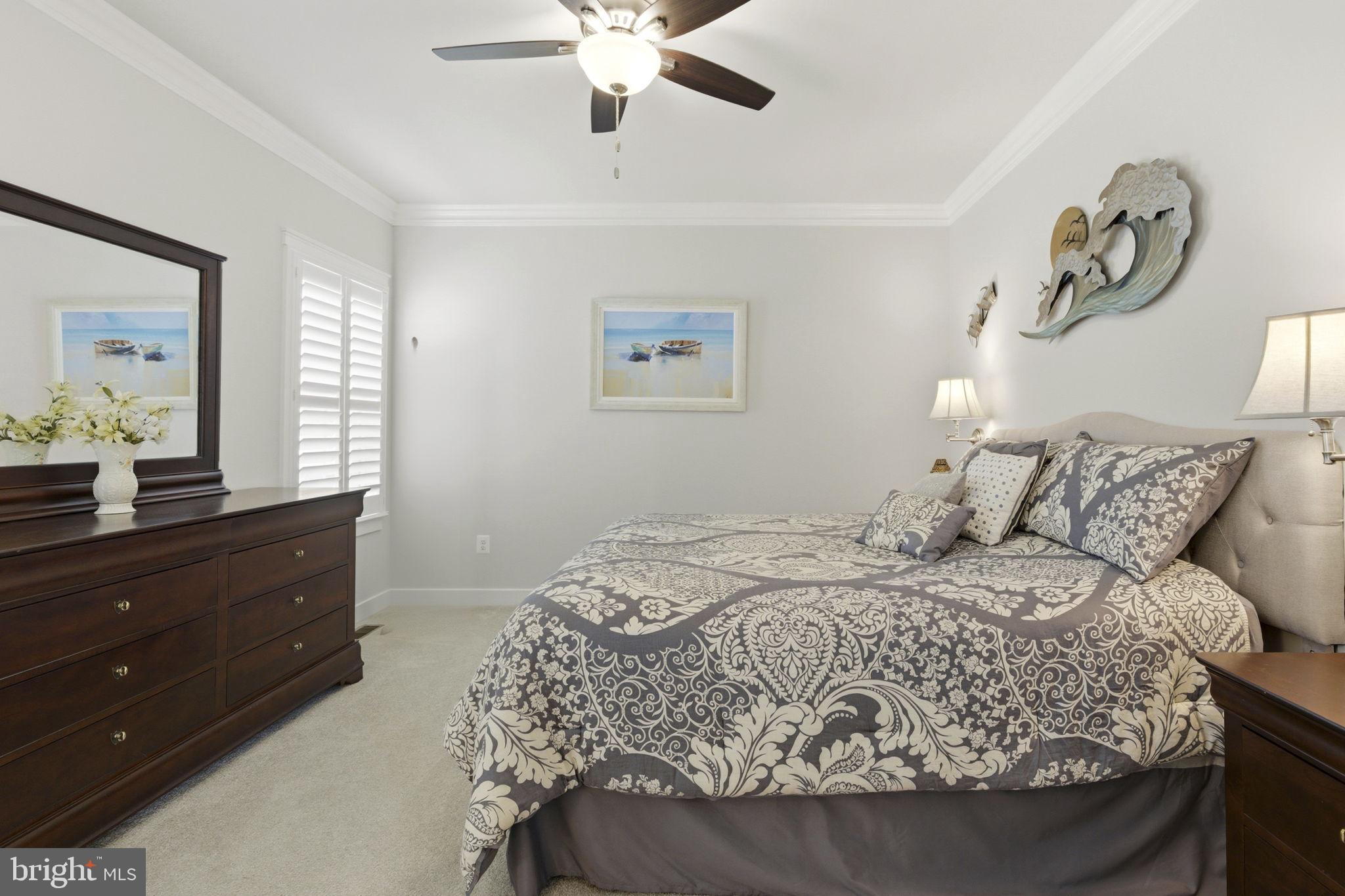 703 Cornerstone Lane Aberdeen, MD 21001 - Photo 13 of 53 a bedroom with a large bed and a chandelier