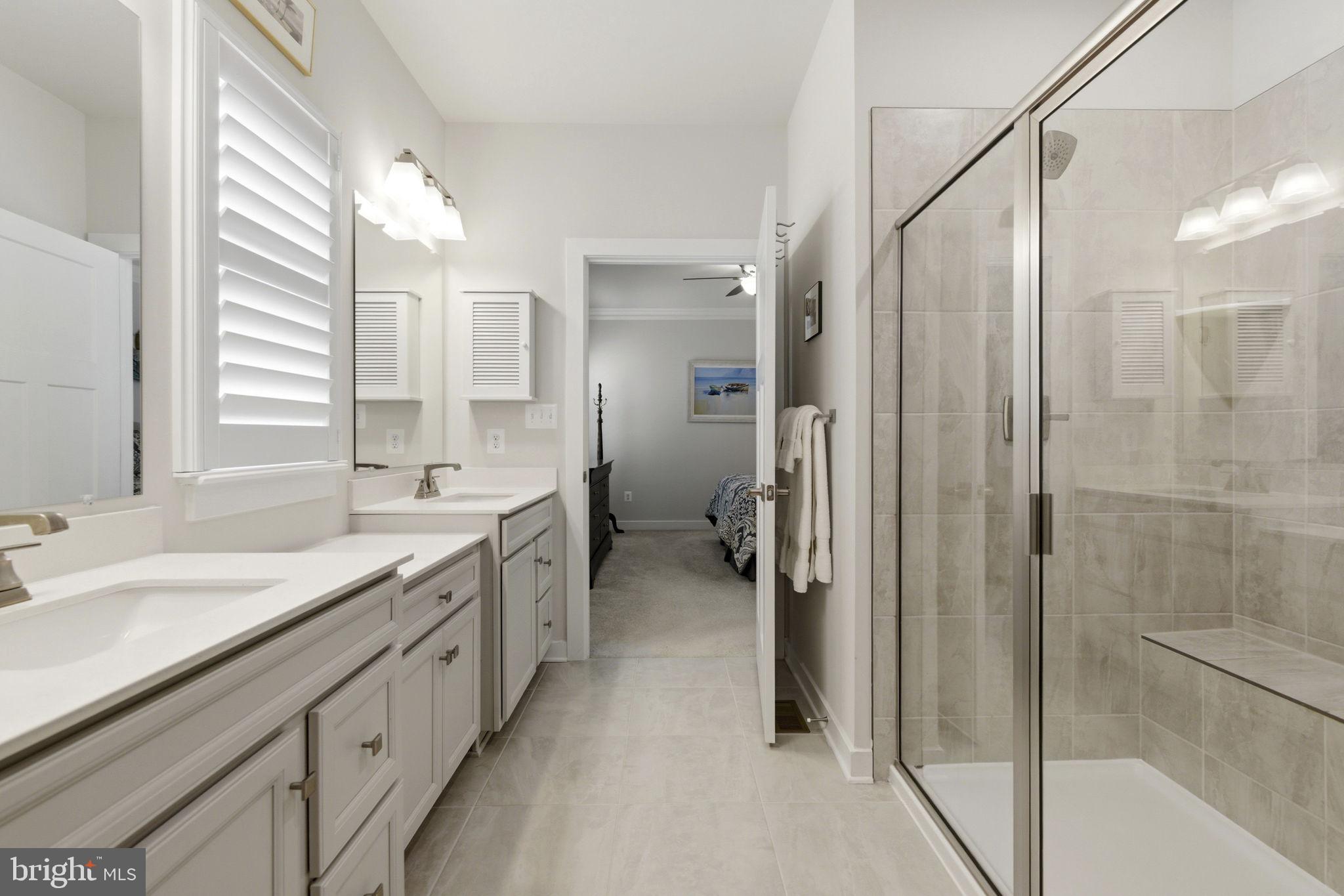 703 Cornerstone Lane Aberdeen, MD 21001 - Photo 16 of 53 a spacious bathroom with a double vanity sink a mirror and a shower