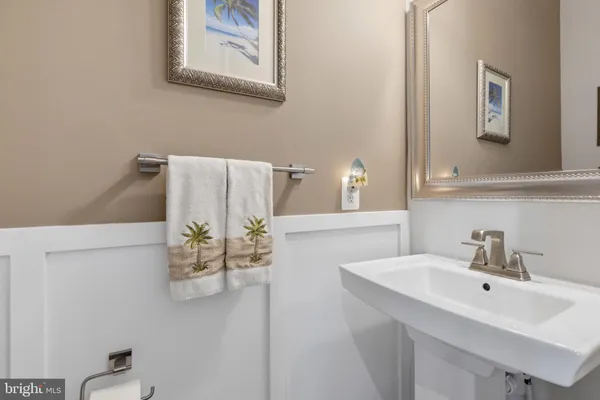 a bathroom with a sink and mirror