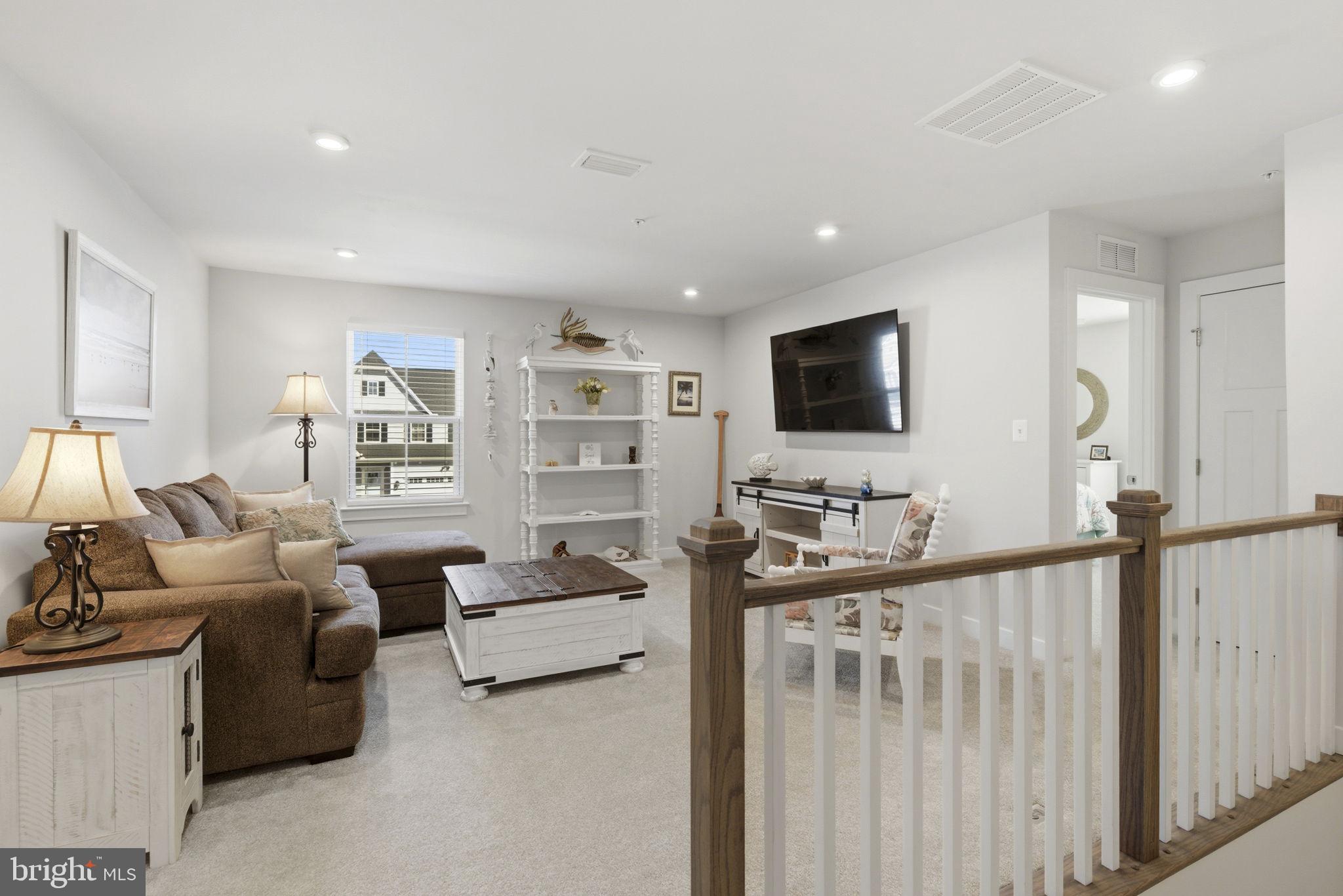 703 Cornerstone Lane Aberdeen, MD 21001 - Photo 20 of 53 a living room with furniture and a flat screen tv