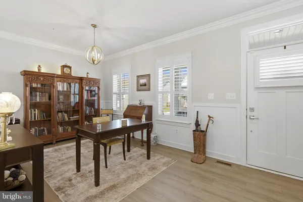 a view of a livingroom with furniture window and wooden floor
