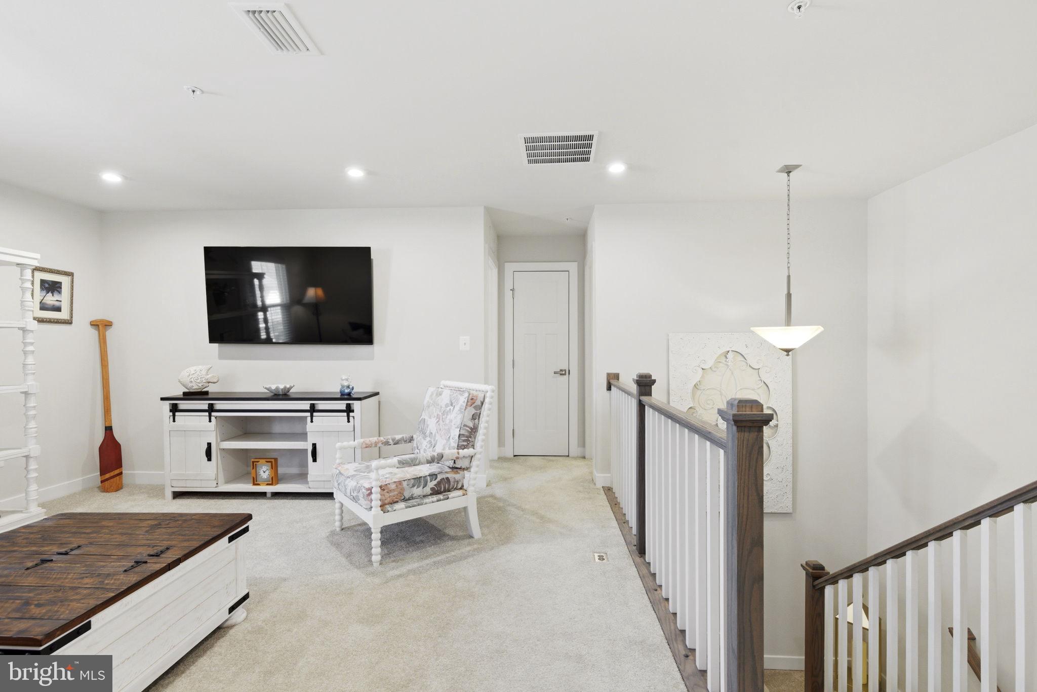 703 Cornerstone Lane Aberdeen, MD 21001 - Photo 22 of 53 a living room with furniture and a flat screen tv
