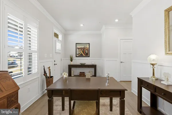 a view of a dining room with furniture and window
