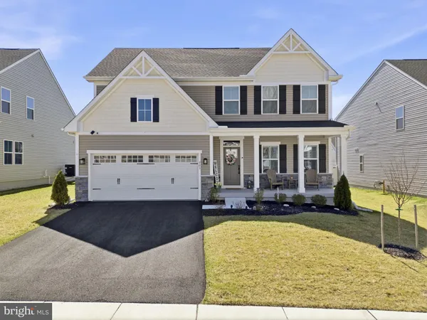 a front view of a house with swimming pool