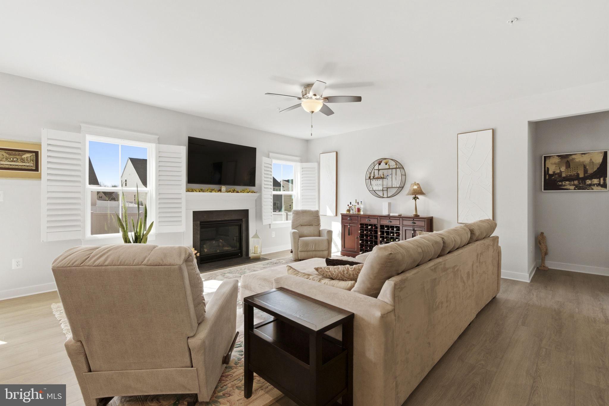 703 Cornerstone Lane Aberdeen, MD 21001 - Photo 6 of 53 a living room with furniture a fireplace and a flat screen tv