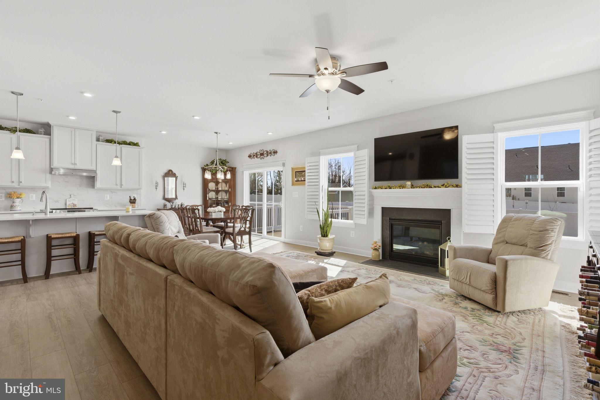 703 Cornerstone Lane Aberdeen, MD 21001 - Photo 7 of 53 a living room with furniture a fireplace and a flat screen tv