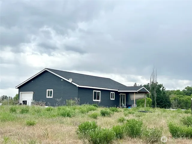 a house with trees in the background