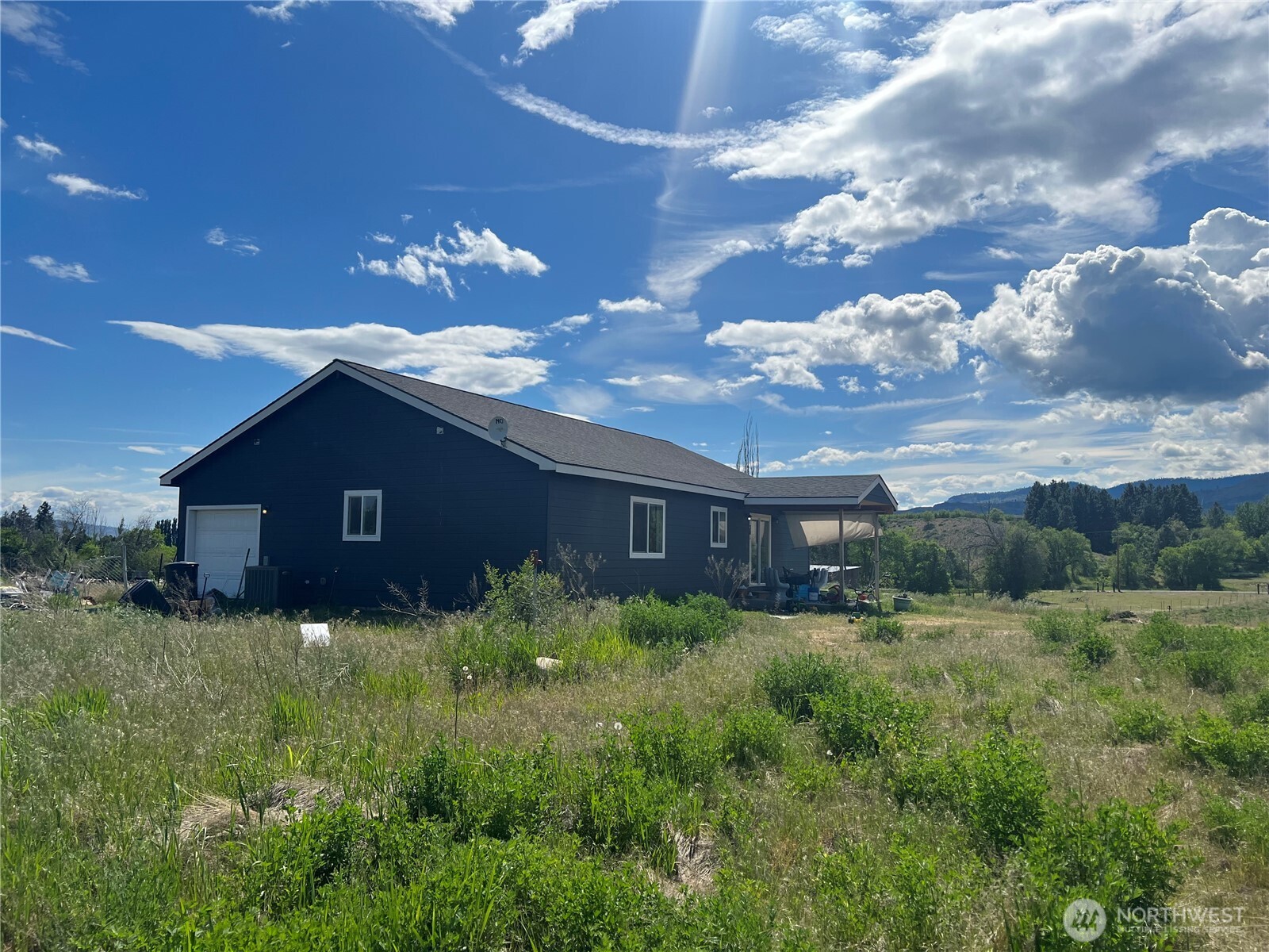 38 Miller Road Omak, WA 98841 - Photo 2 of 29 a view of a house with a yard