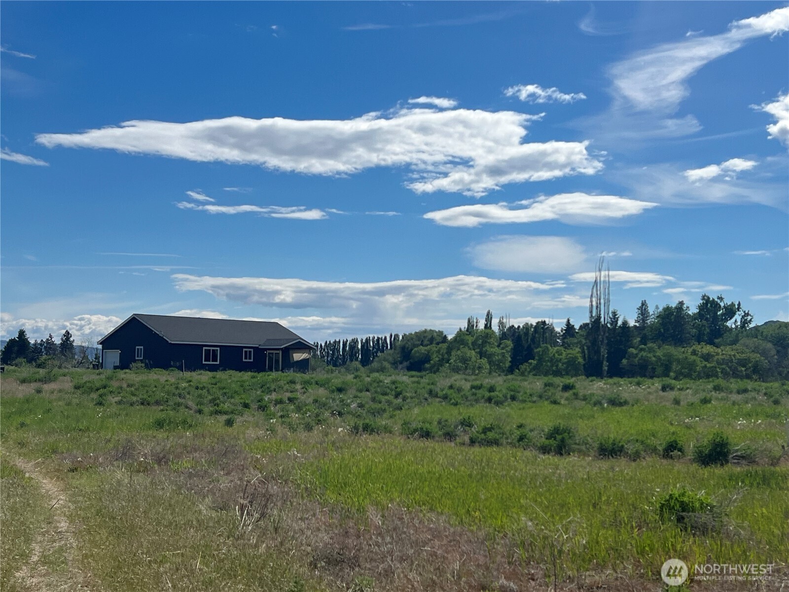 38 Miller Road Omak, WA 98841 - Photo 23 of 29 a view of a big yard with lots of green space