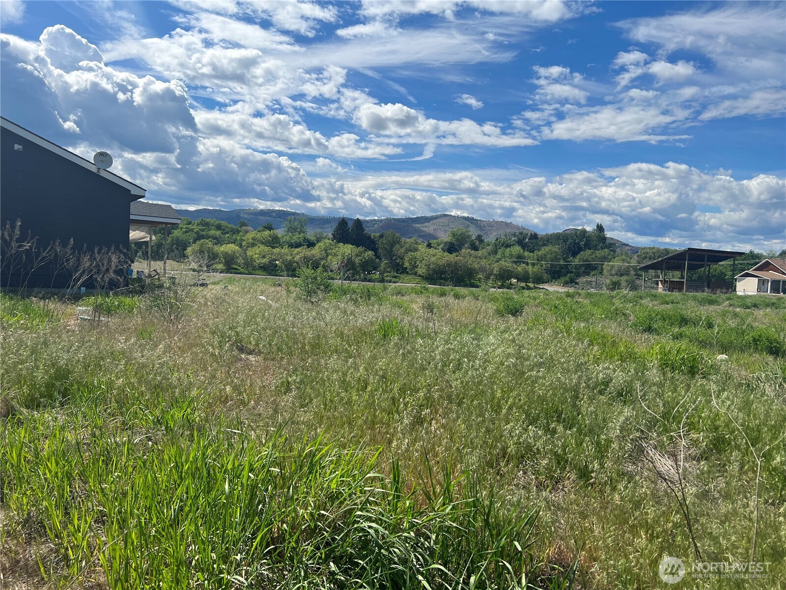 38 Miller Road Omak, WA 98841 - Photo 29 of 29 a view of a lush green outdoor space with swimming pool