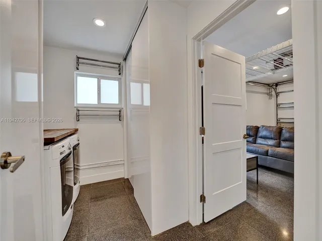 a view of a storage & utility room with washer and dryer