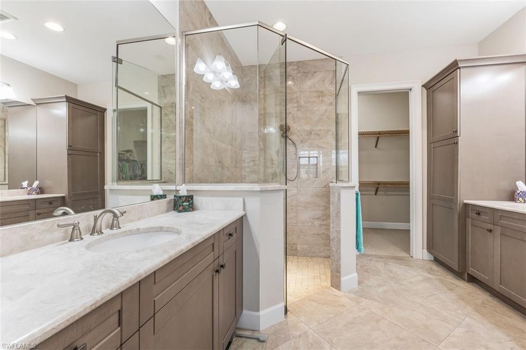 6931 Cay Court Naples, FL 34113 - Photo 10 of 24 Bedroom with light colored carpet and ornamental molding